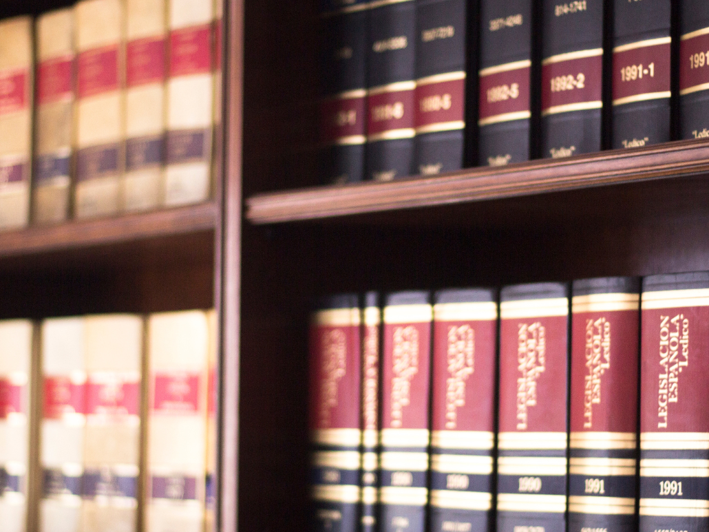 Close-up of legal books on a library shelf.