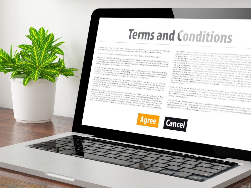 Laptop computer featuring a terms and conditions screen with large ‘disagree’ and ‘agree’ buttons.
