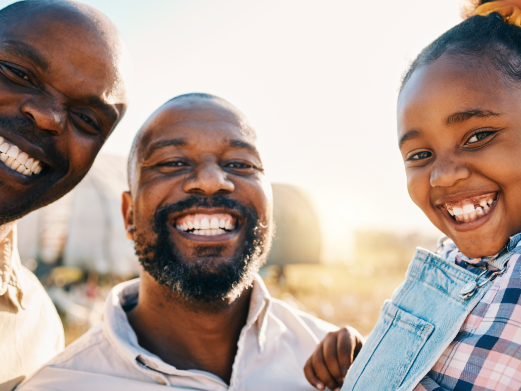  A family of three taking a selfie together.