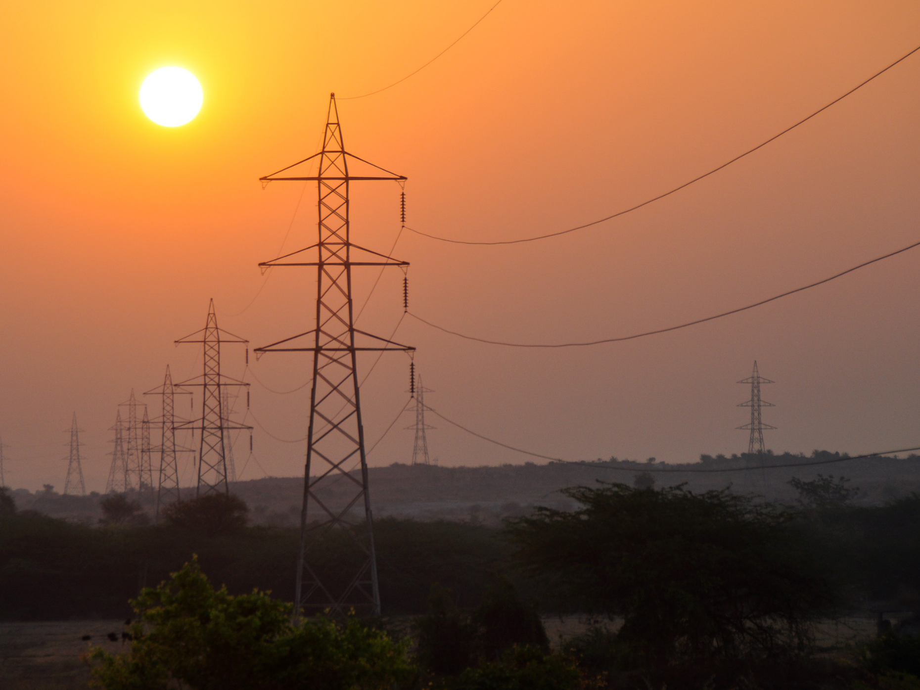 Electrical transmission towers at sunset.