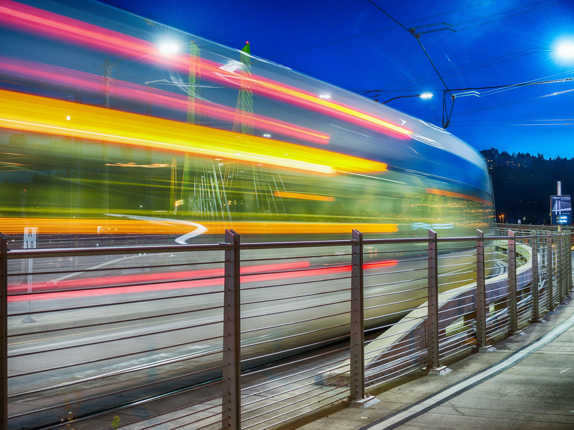 Motion blur of a colorful MAX train at night.