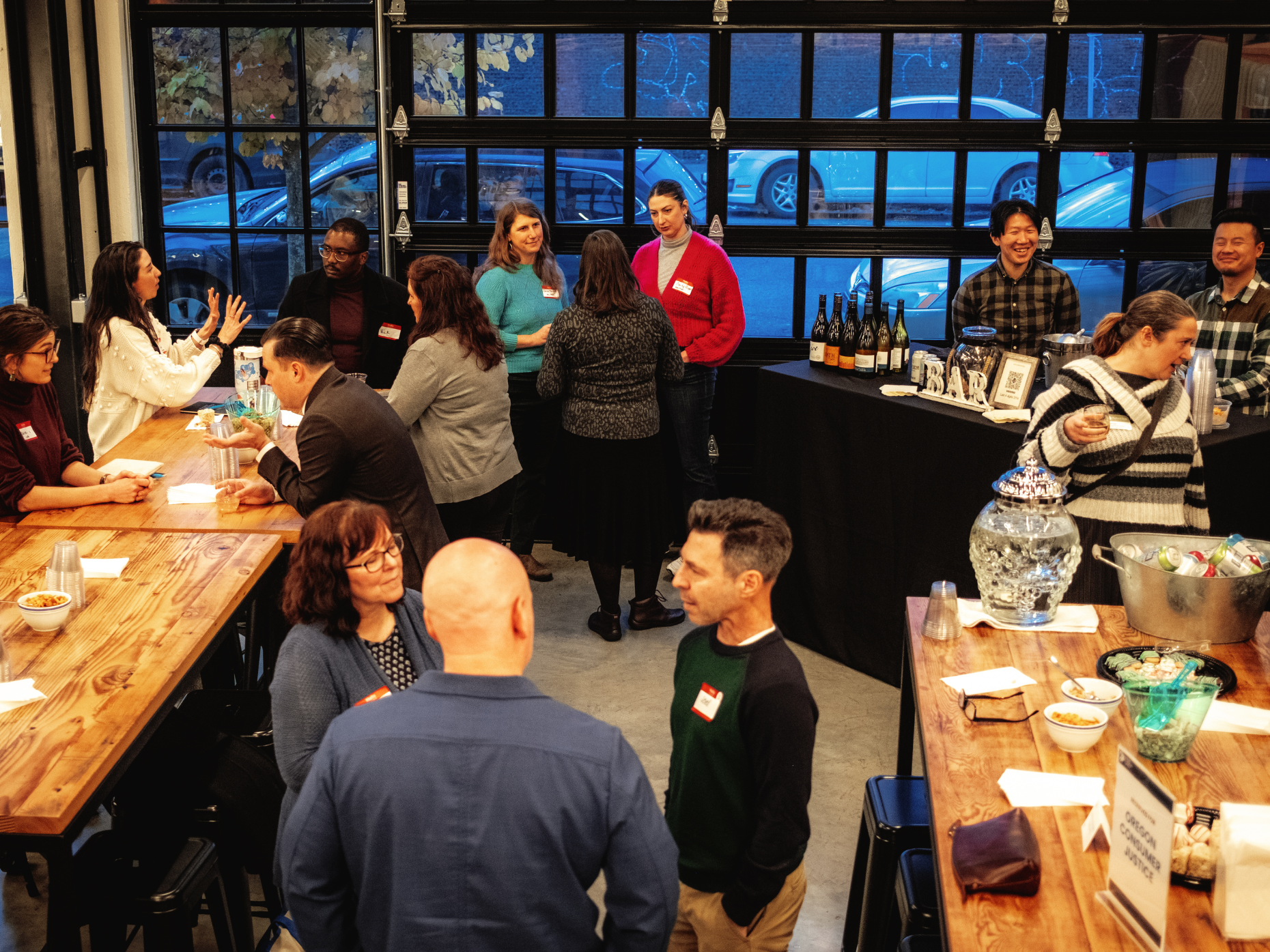 A group of CLE attendees convene for conversation and refreshments during the Community Gathering Hour.