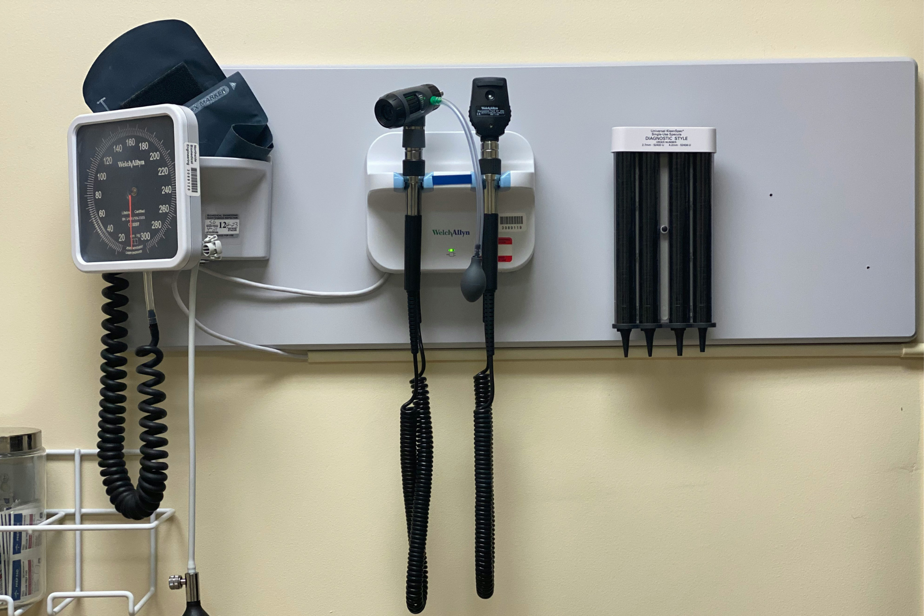 A photo of medical instruments on a wall in a doctor's office.