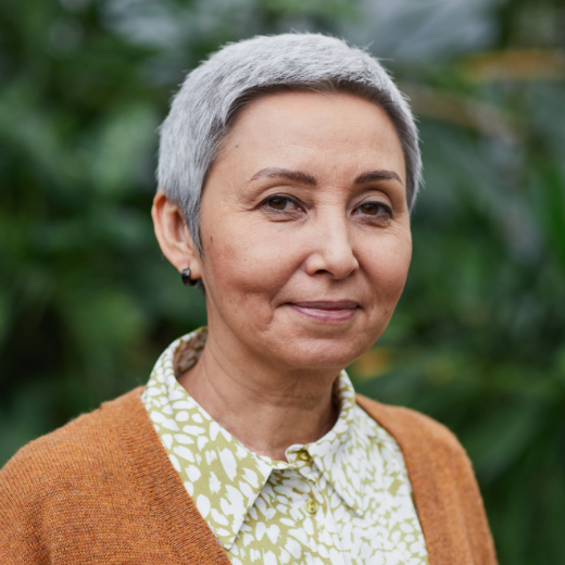 Portrait of a woman with short hair.